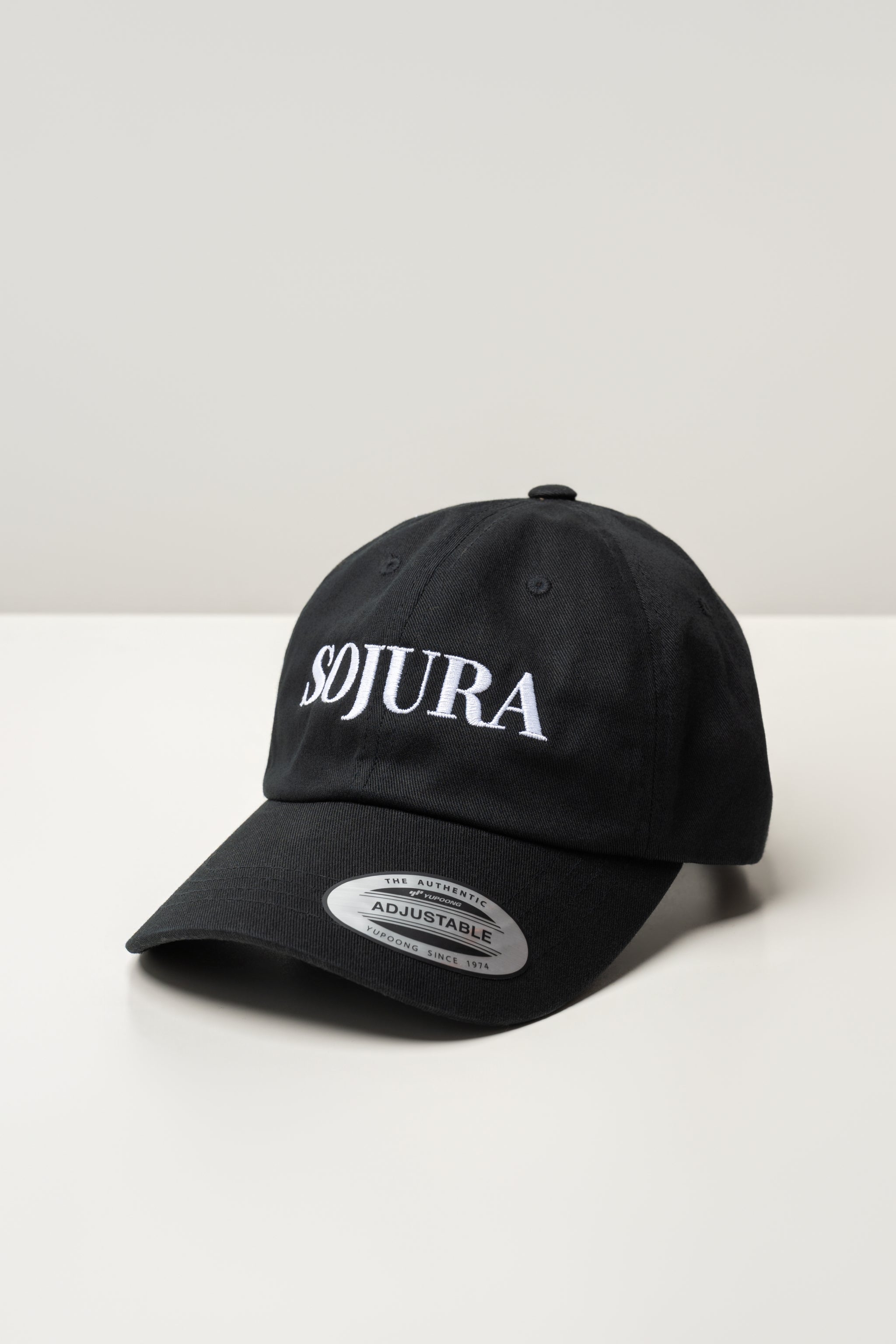 black ballcap with sojura logo embroidered across the front