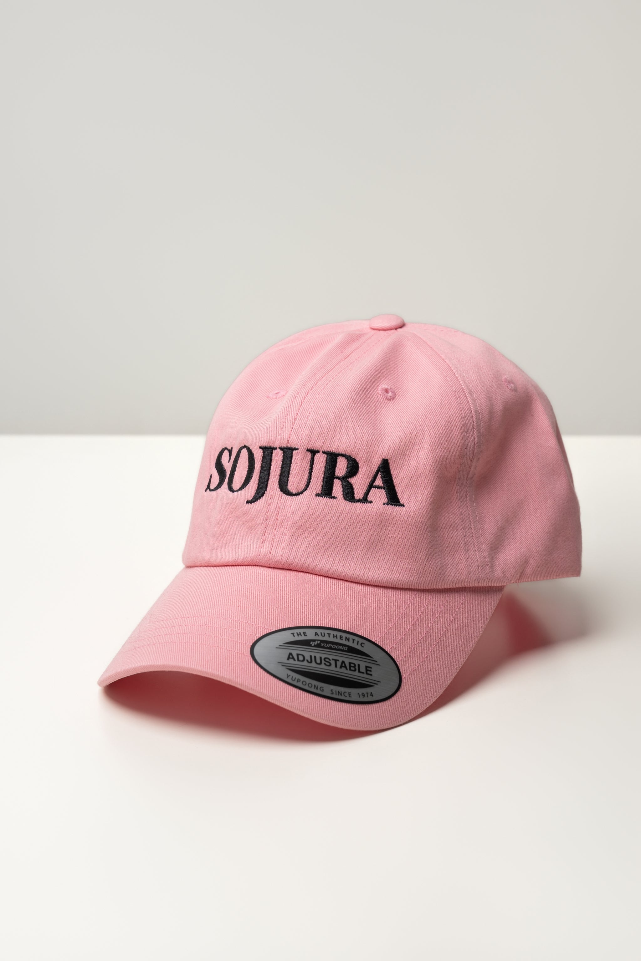pink ballcap with sojura logo embroidered across the front